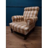 19th C. Strahan & Co. of Dublin upholstered easy chair raised on turned legs and brass castors {94
