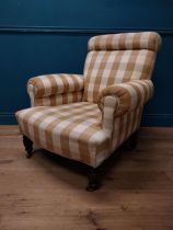 19th C. Strahan & Co. of Dublin upholstered easy chair raised on turned legs and brass castors {94