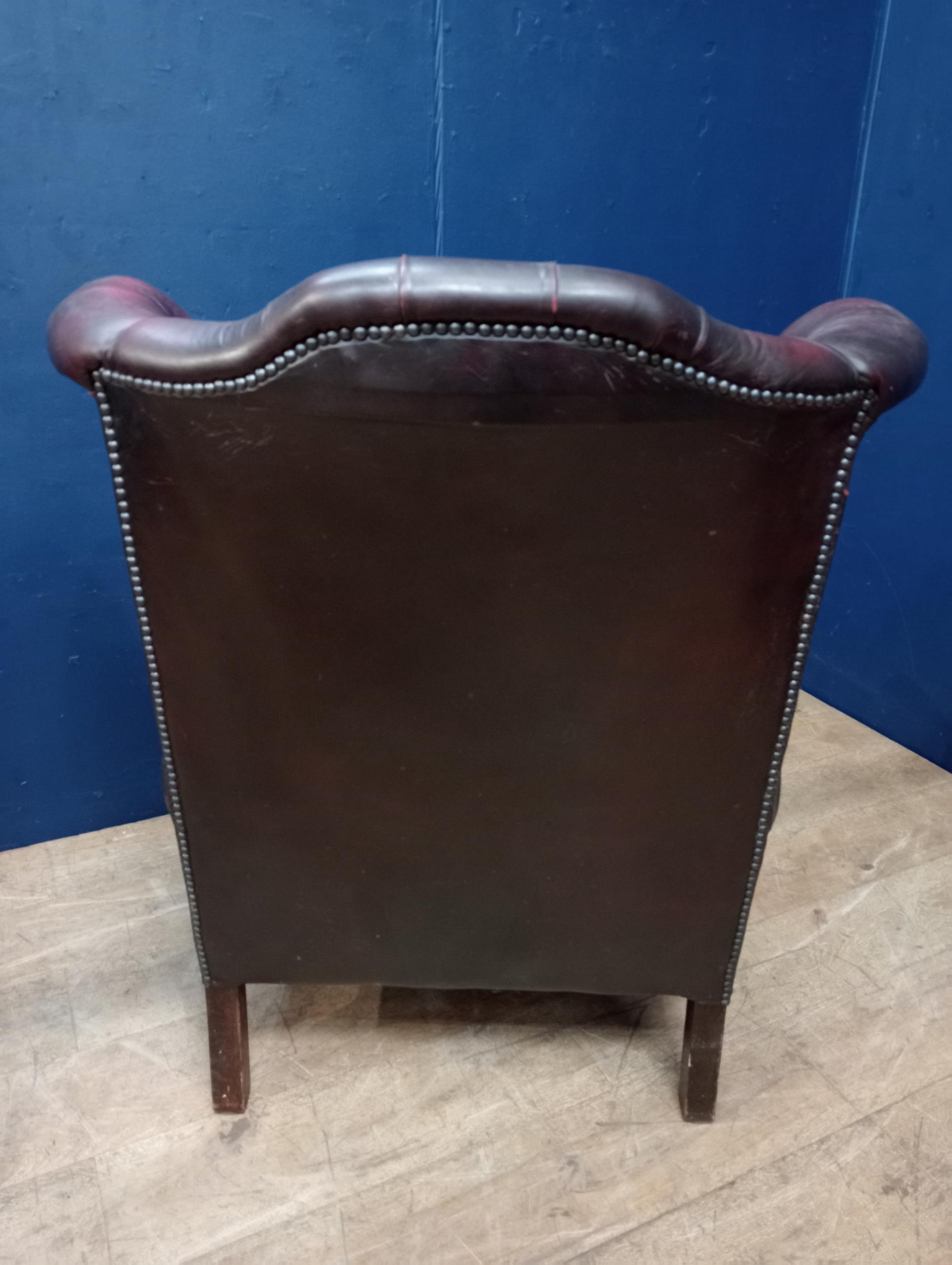 Deep buttoned leather wingback chair raised on Queen Ann legs {H 109cm x W 83cm x D 90cm }. - Image 3 of 3