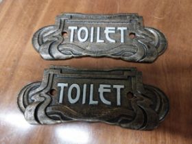 Pair of cast iron Toilet signs in the Art Deco style {7 cm H x 18 cm W}.