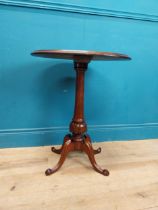 19th C. mahogany wine table on turned column four outswept feet and quartered veneered top. {58 cm H