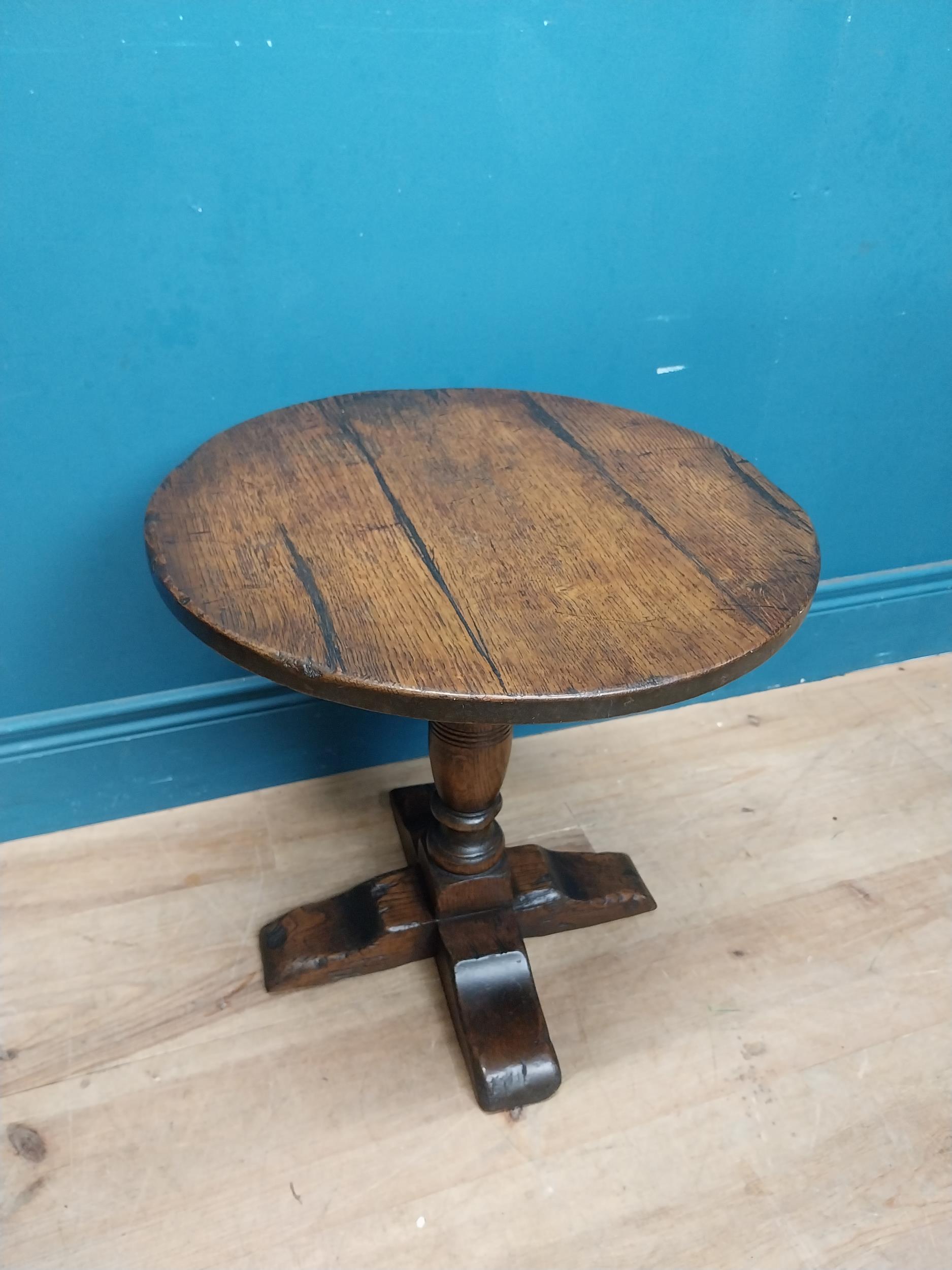 Oak wine table on turned column with four outswept shaped feet. {45 cm H x 45 cm Dia.}. - Image 2 of 6