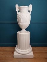20th C. Grand Tour plaster Grecian Urn on Pedestal. {147 cm H x 56 cm W x 56 cm D}.