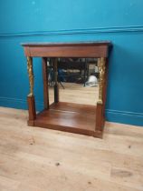 Good quality mahogany and gilded console table with marble top and mirrored back in the Empire