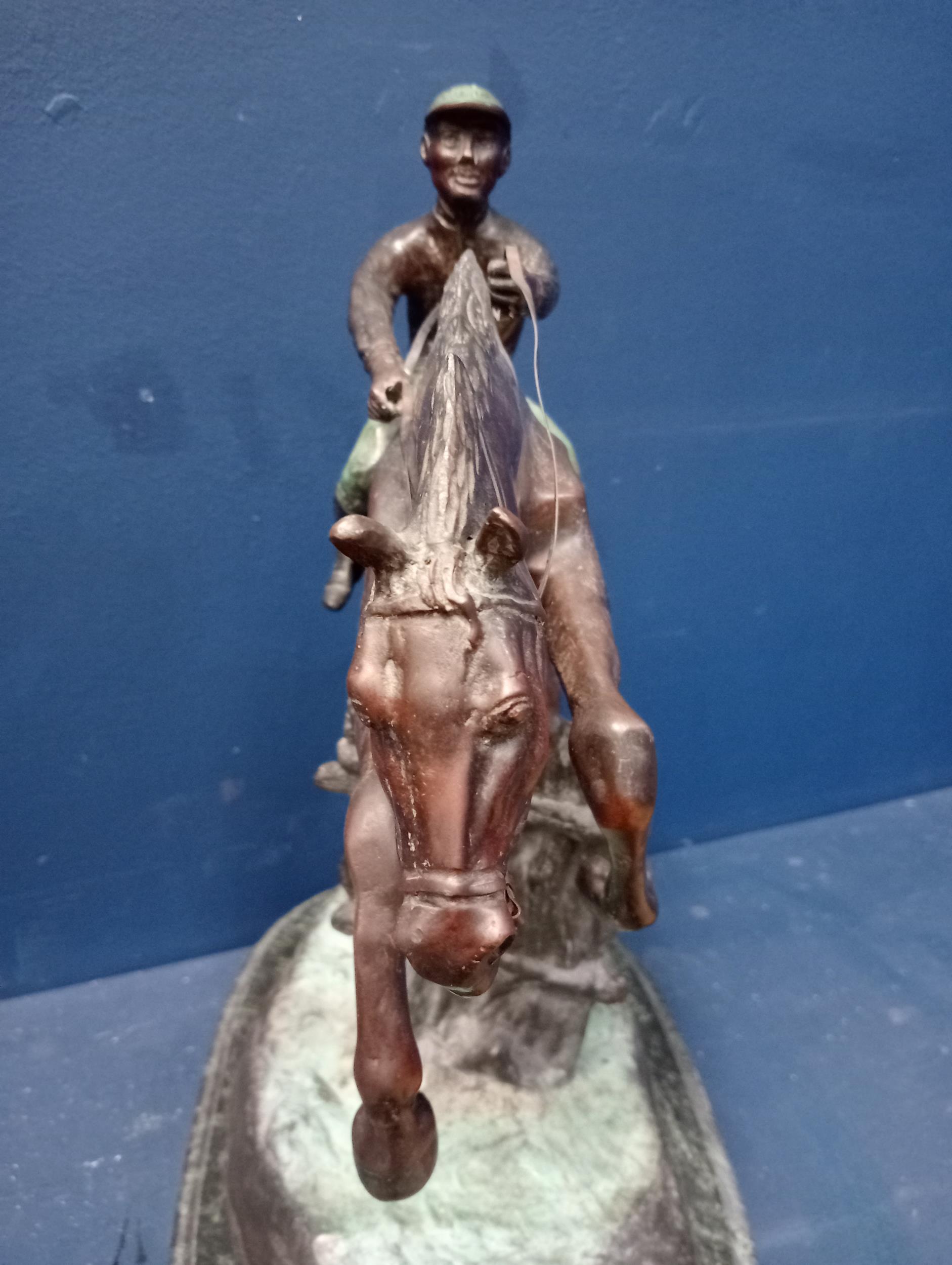 Bronze model of a horse and jockey mounted on marble base {H 43cm x W 36cm x D 22cm }. - Image 4 of 5