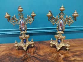 Pair of gilded metal candelabras with ceramic panels depicting Knights. {32 cm H x 22 cm W x 8 cm