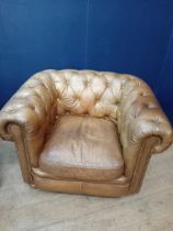 Pair of deep buttoned leather Chesterfield club chairs {H 74cm x W 110cm x D 94cm }.