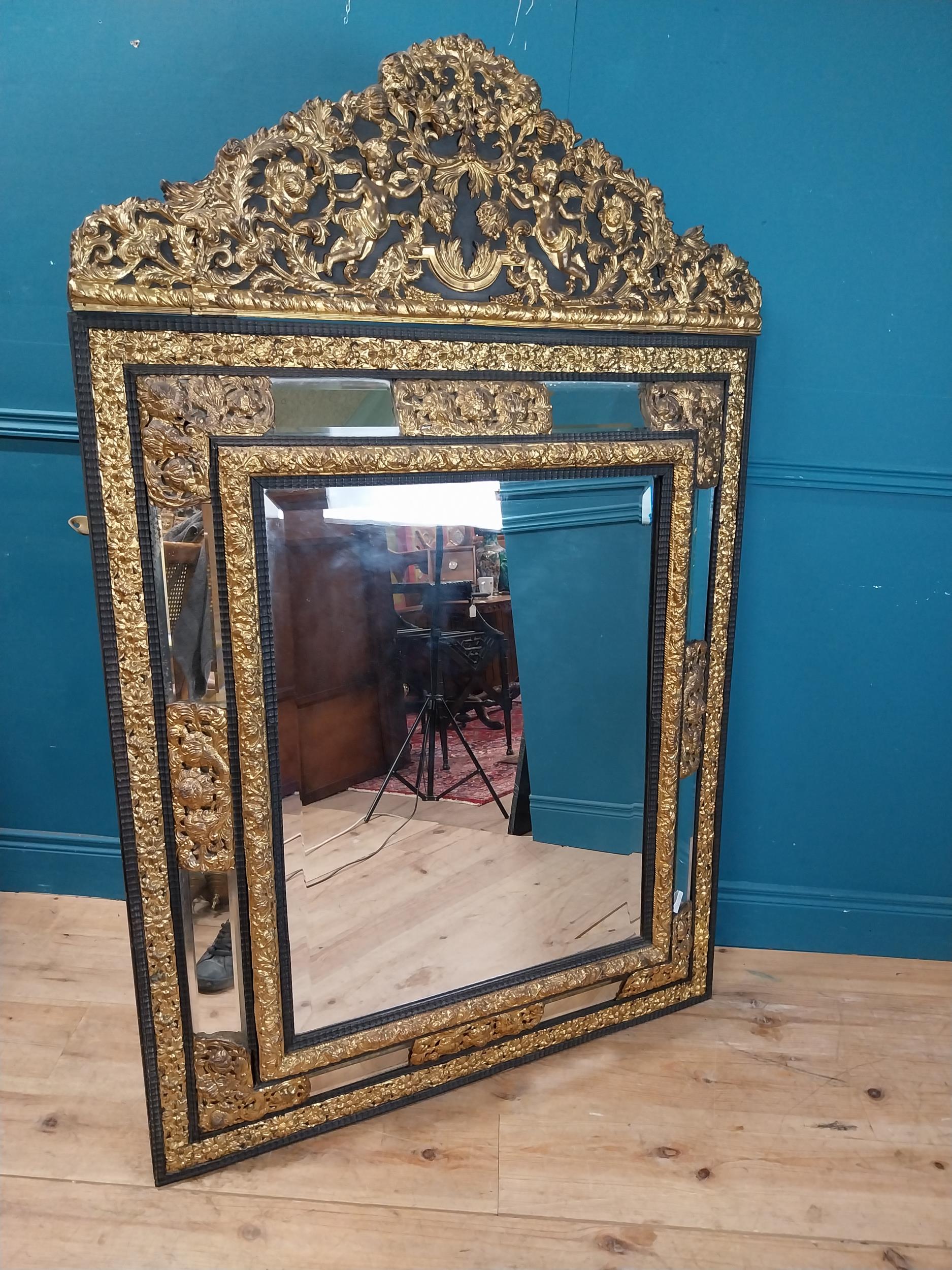 19th C. French brass and ebonised cushion mirror surmounted with cherub and flora and foliage - Image 6 of 8