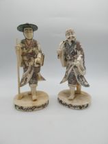 Pair of Oriental resin figures. {34 cm H x 15 cm W x 15 cm D}.