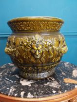 19th C. green glazed majolica jardiniere with mask and floral decoration with W. and Co 844 stamp on