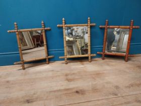 Three early 20th C. faux bamboo pine wall mirrors {52 cm H x 42 cm W and 47 cm H x 41 cm W}.