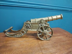 Edwardian brass desk cannon. {19 cm H x 43 cm W x 14 cm D}.