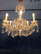 Brass and crystal eight branch chandelier {H 90cm x Dia 70cm}.