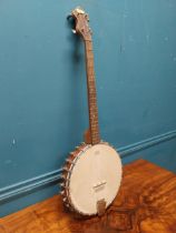 The Vernon four string Banjo. {86 cm H x 31 cm W x 7 cm D}.