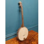 The Vernon four string Banjo. {86 cm H x 31 cm W x 7 cm D}.