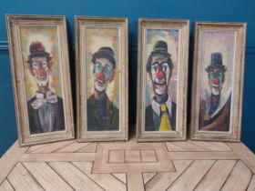 Set of four early 20th C. Clown oil on canvases mounted in wooden frames {70 cm H x 29 cm W}.