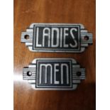 Pair of cast iron Ladies and Men signs in the Art Deco style {7 cm H x 18 cm W}.