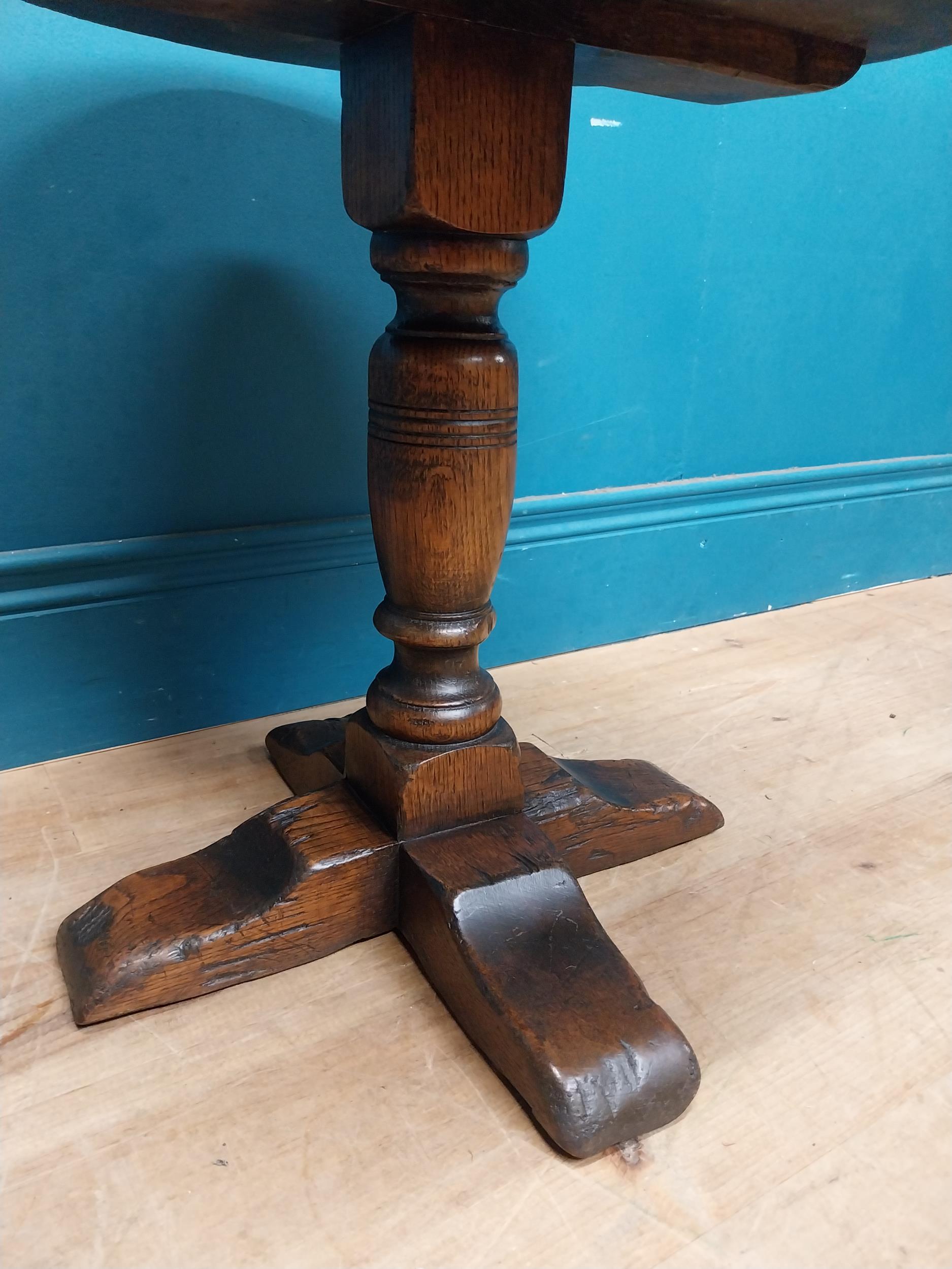 Oak wine table on turned column with four outswept shaped feet. {45 cm H x 45 cm Dia.}. - Image 4 of 6