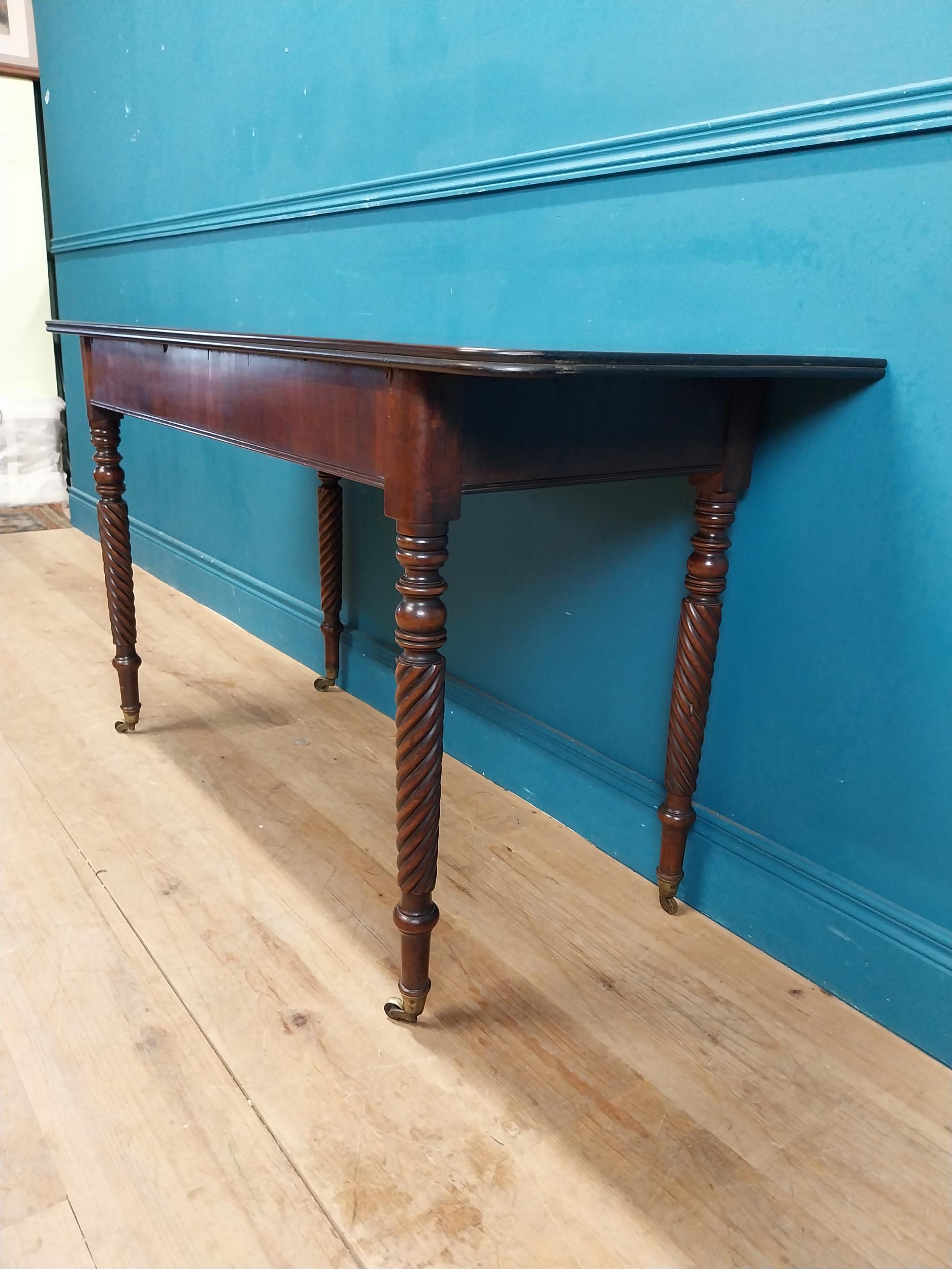 Regency mahogany side table raised on four turned legs. {74 cm H x 132 cm W x 52 cm W}. - Image 4 of 4