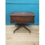 Walnut drop leaf centre table with leather top raised on carved column, four outswept feet and