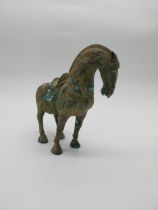 Bronze model of oriental Horse. {24 cm H x 28 cm W x 11 cm D}.