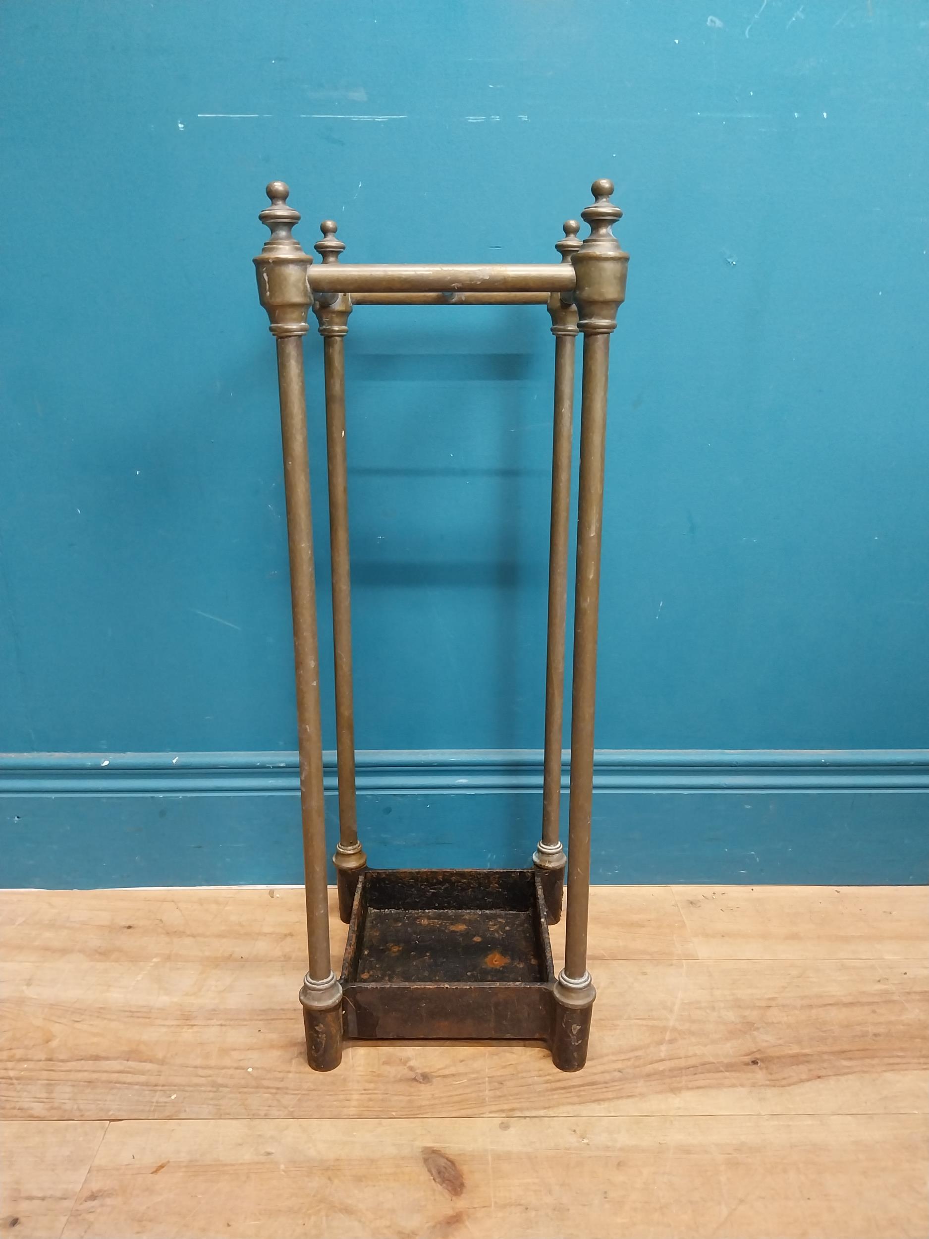 Edwardian brass and cast iron stick stand. {62 cm H x 22 cm W x 22 cm D}.