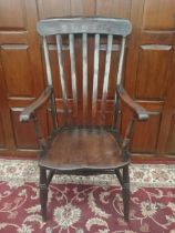 Oak slat back armchair with dish seat raised on turned legs {H 107cm x W 56cm x D 42cm }.