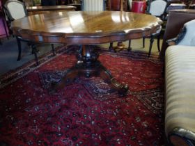 Exceptional quality 19th C. rosewood centre table raised on carved column and three outswept feet by