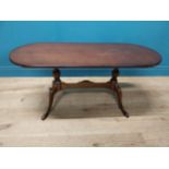 Mahogany coffee table, raised on turned supports and single stretcher. { 53cm H X 114cm W X 46cm