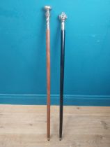 Two walking sticks with silver plate ferrules. {90 cm H}.