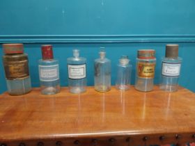 Set of seven early 20th C. glass chemist's jars with original labels.