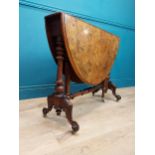 19th C. burr walnut Sutherland table with turned legs raised on arched feet with castors. {73 cm H x