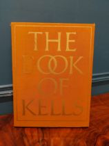Reproduction copy of Book of Kells in wooden presentation case. {36 cm H x 27 cm W}.