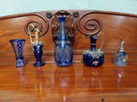 Five pieces of 19th C. blue glass vases and jugs.