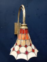 Brass stained glass and leaded wall light in the Tiffany style {H 34cm x W 16cm x D 30cm }.