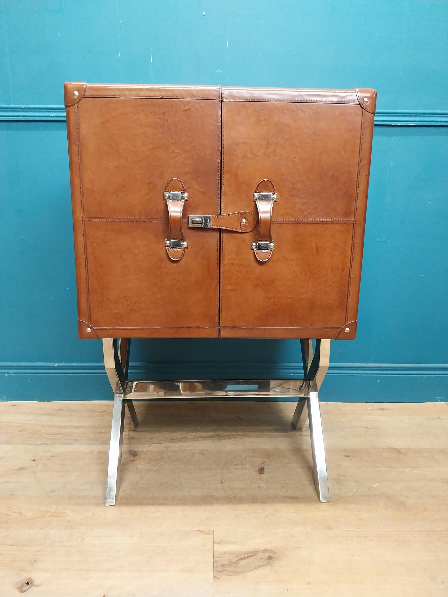 Leather and chrome bar the two doors enclosing shelves pigeon holes and a drawer, raised on X - - Image 4 of 12