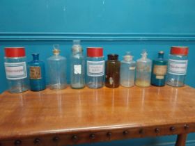 Set of ten early 20th C. glass chemist's jars with original labels.