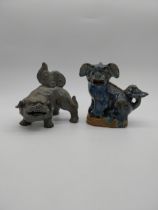 Two oriental glazed ceramic Dogs of Fu. {16 cm H x 19 cm W x 9 cm D} and {16 cm H x 16 cm W x 11
