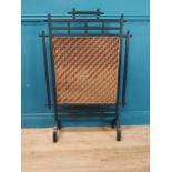 Edwardian oriental ebonised fire screen. {103 cm H x 70 cm W x 23 cm D}.