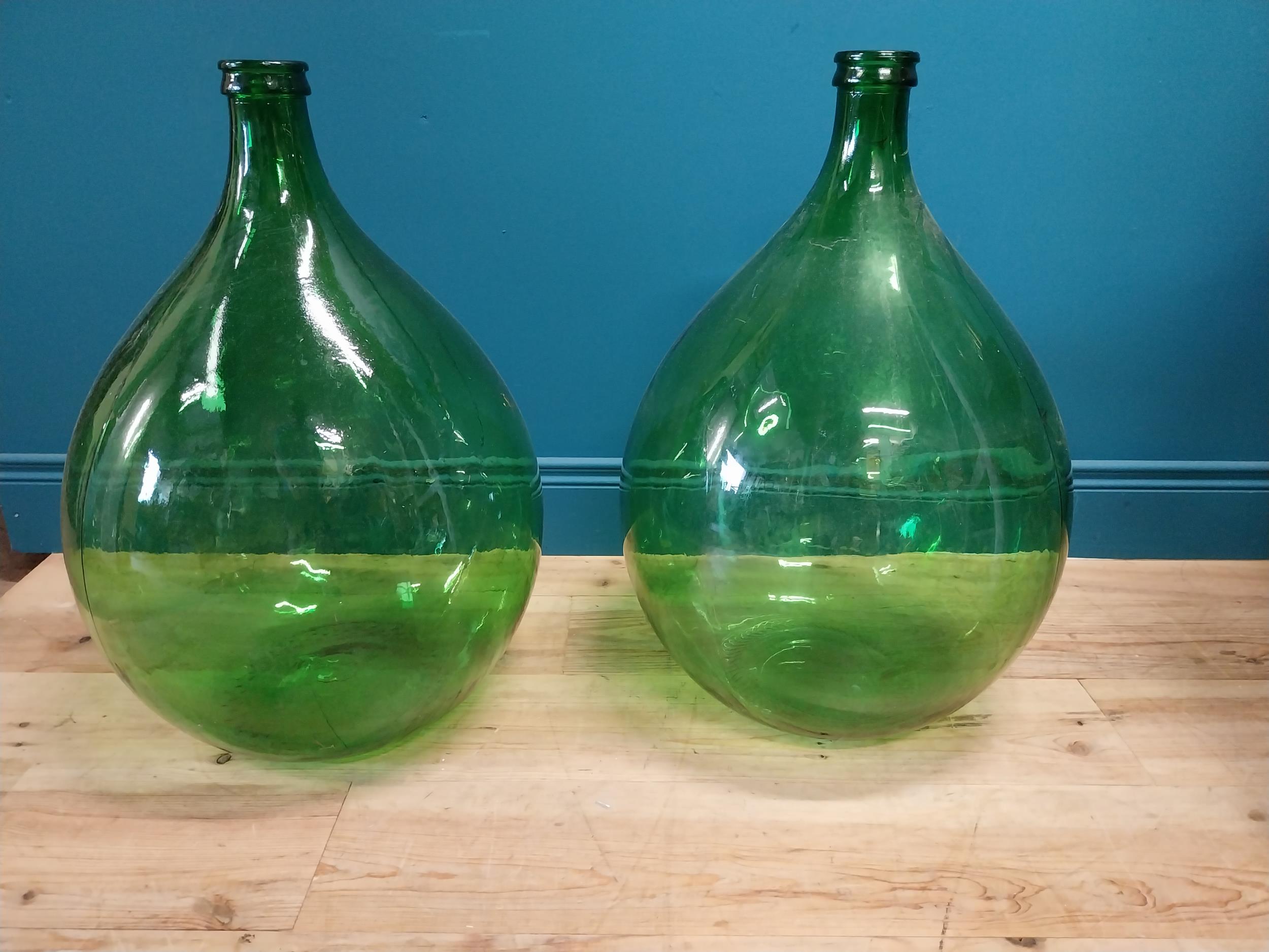 Pair of 19th C. green carboy glass bottles. {70 cm H x 43 cm Dia.}.