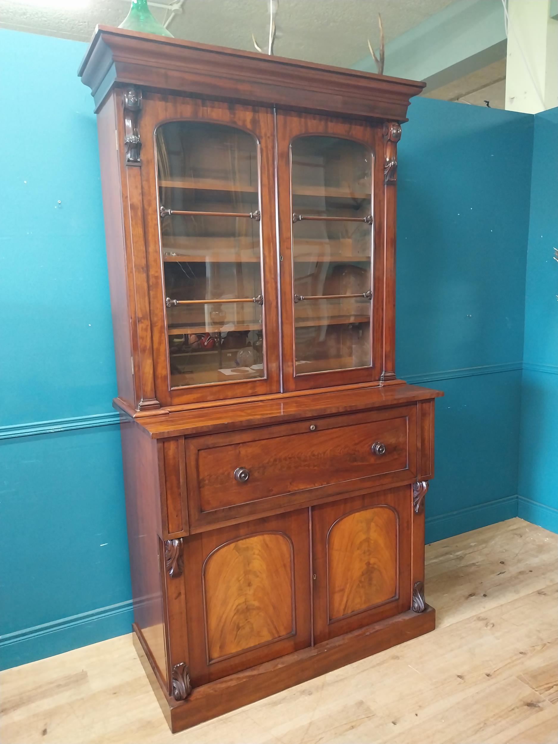 19th C. mahogany bureau bookcase with two glazed doors and fitted interior over two blind doors {231