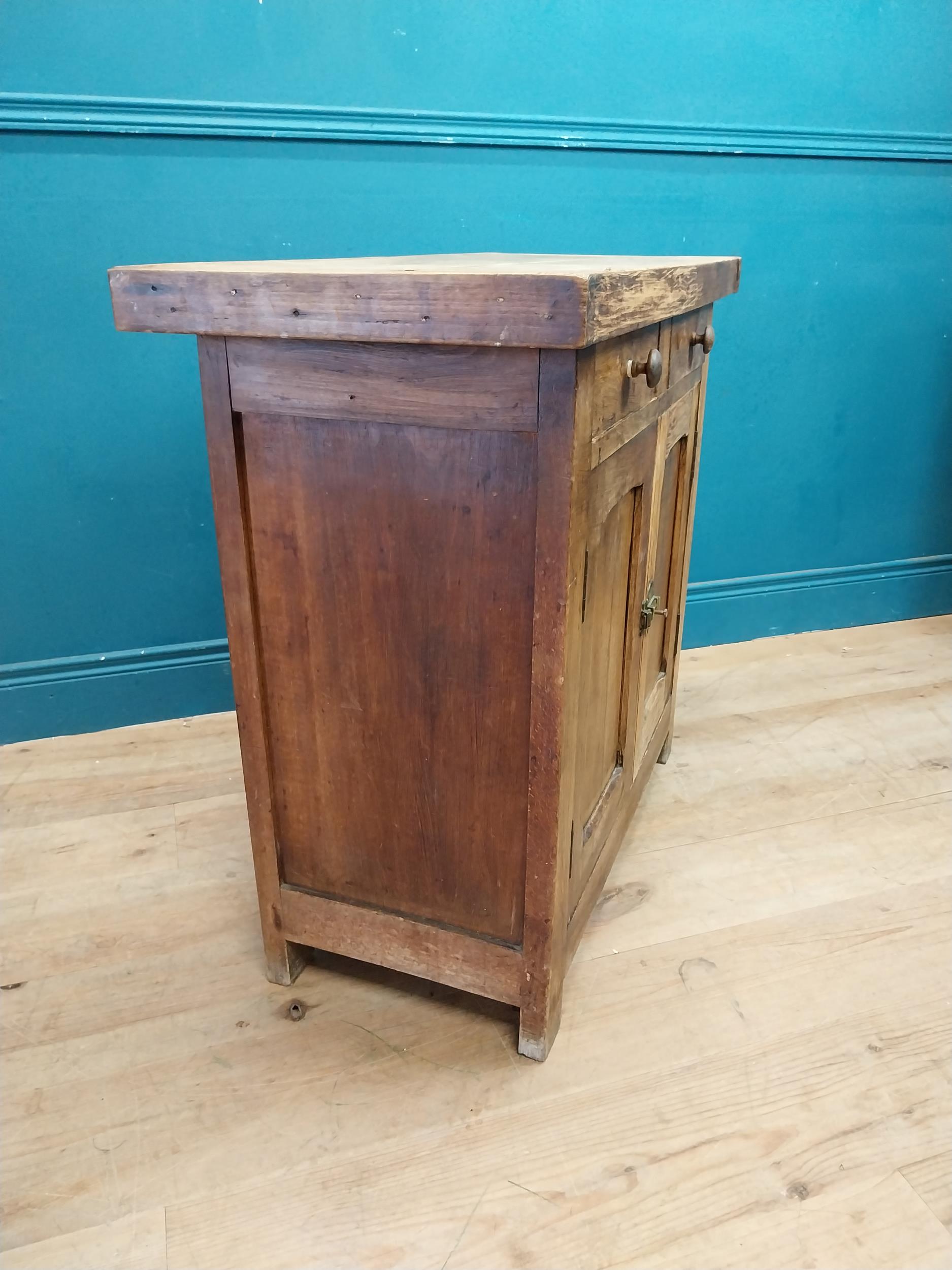 Early 20th C. oak and pine cupboard with two long doors over two short drawers on square feet. {80 - Image 5 of 9