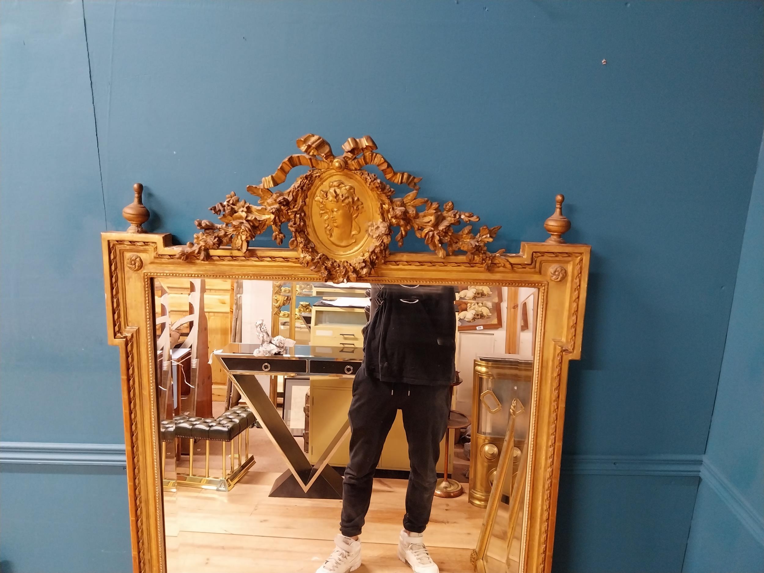 19th C. French gilt mirror with floral decoration surmounted with female mask and bows. {168 cm H - Image 10 of 10