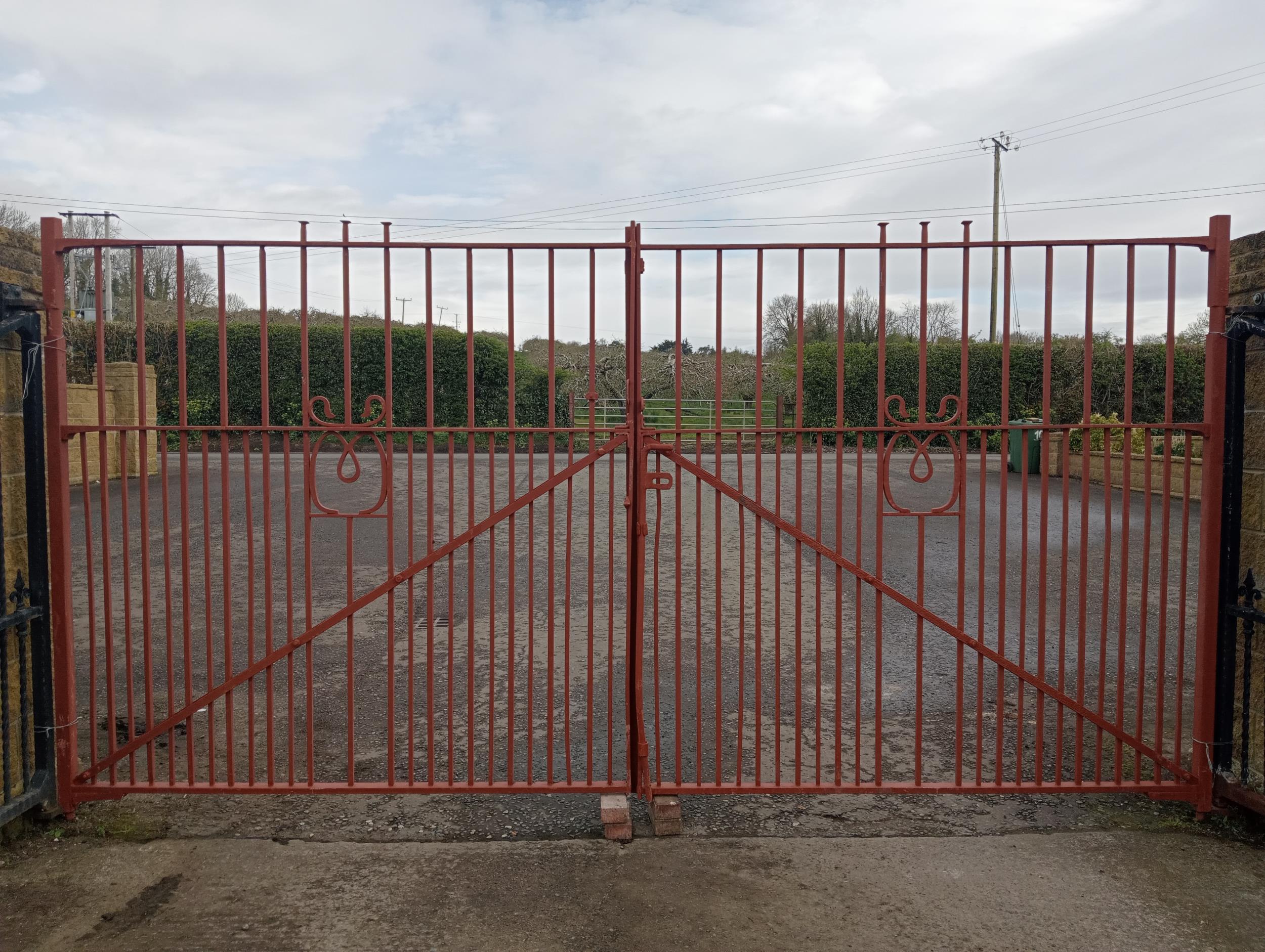 Pair of forged wrought iron riveted entrance gates {H 220cm x W 463cm x D 6cm}. (NOT AVAILABLE TO