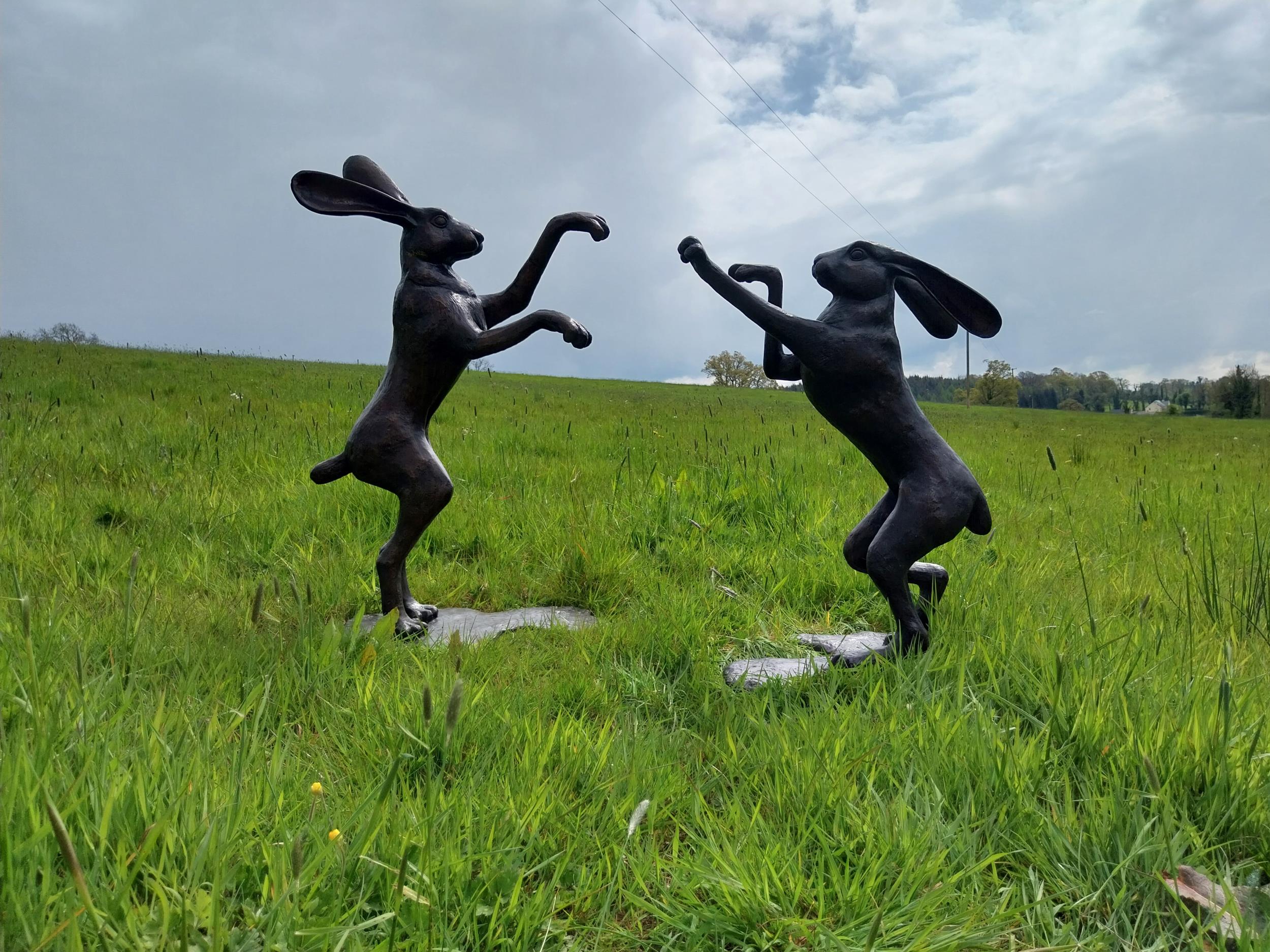 Exceptional quality bronze statues of Boxing Hares