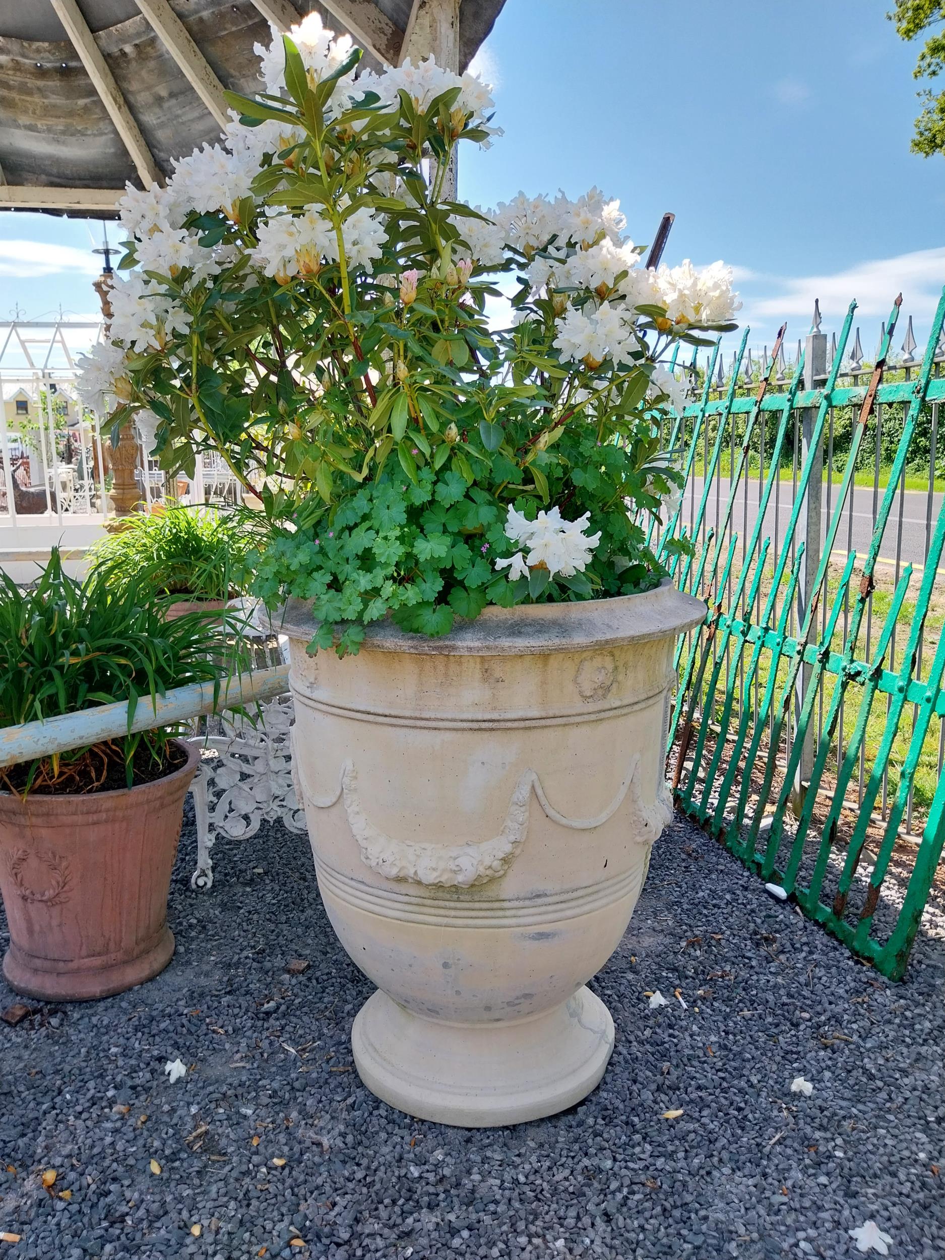 Pair of large moulded sandstone urns decorated with swags including plants {Urns dimensions 100 cm H - Image 4 of 5