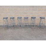 Six metal matrix high stools with upholstered seat {}. (NOT AVAILABLE TO VIEW IN PERSON)