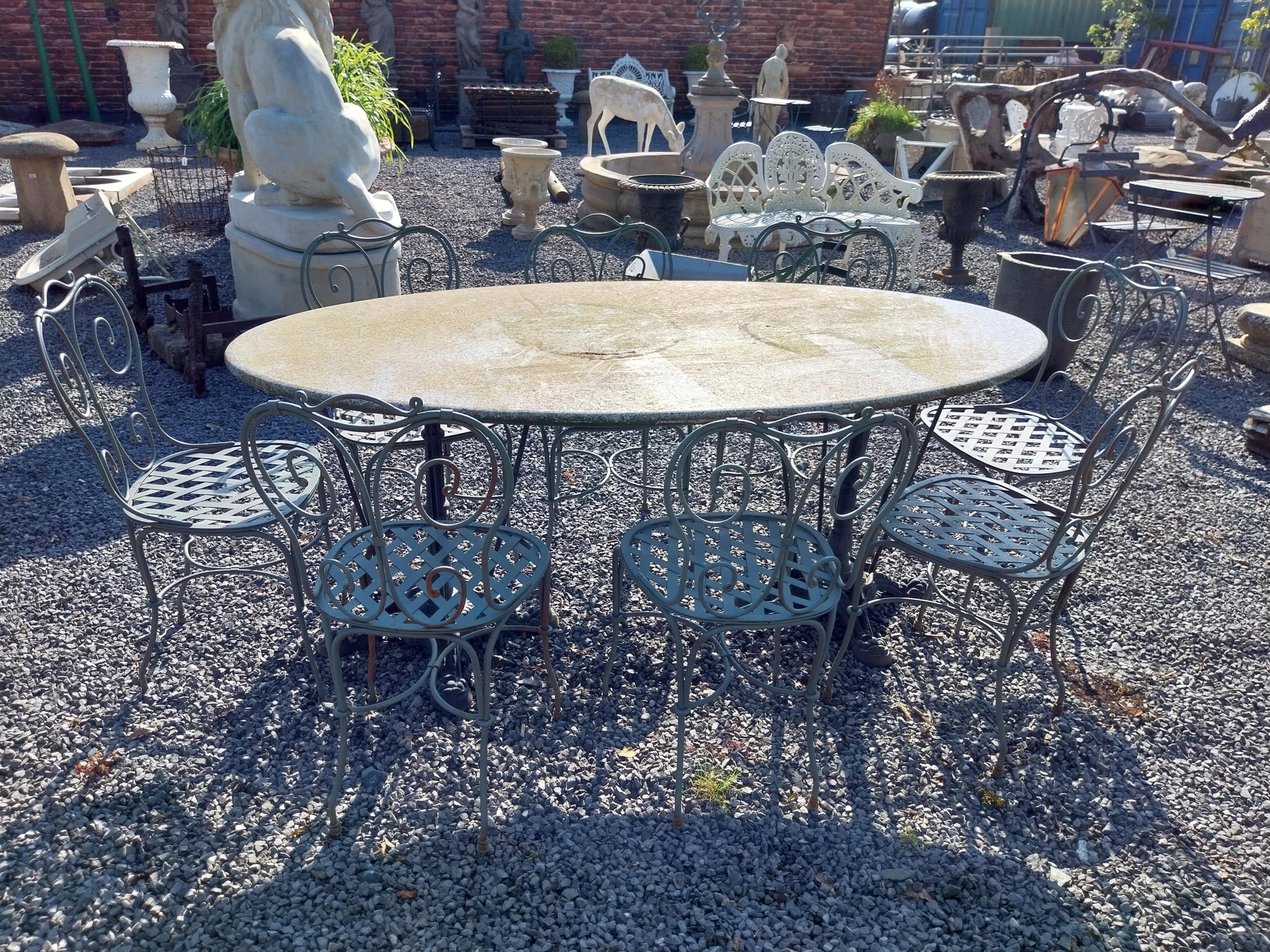 Cast iron garden table with marble top and eight good quality wrought iron garden chairs {Tbl. 75 cm