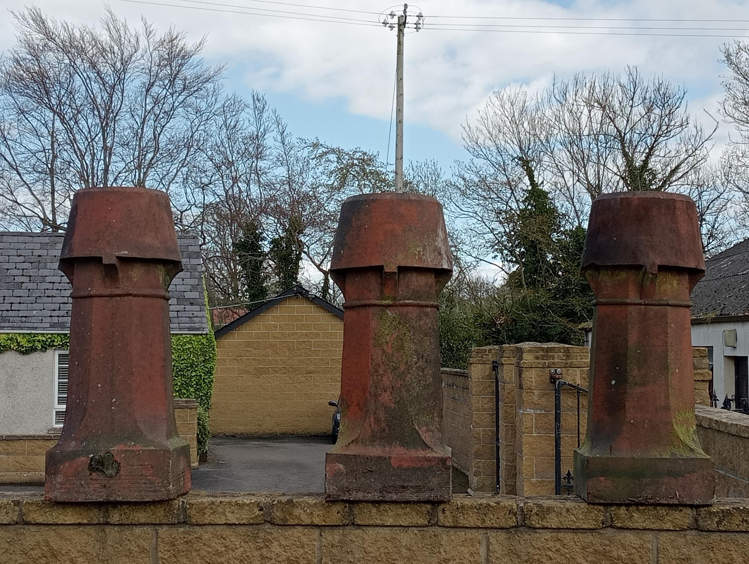 Three terracotta chimney pots {H 90cm x 34 x 34 }. (NOT AVAILABLE TO VIEW IN PERSON)