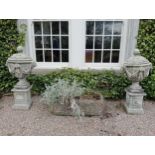 Pair of composition lidded urns decorated with swags and lion masks raised on pedestals {H 124cm x W